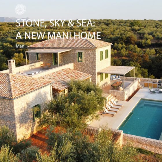 Stone house in Mani, Greece overlooking olive groves and the sea